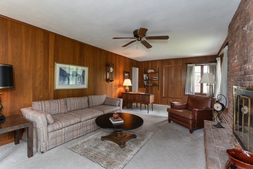 35 Squire Lane Springfield, MA 01118 - Photo 8 of 28 a living room with furniture a flat screen tv and a window