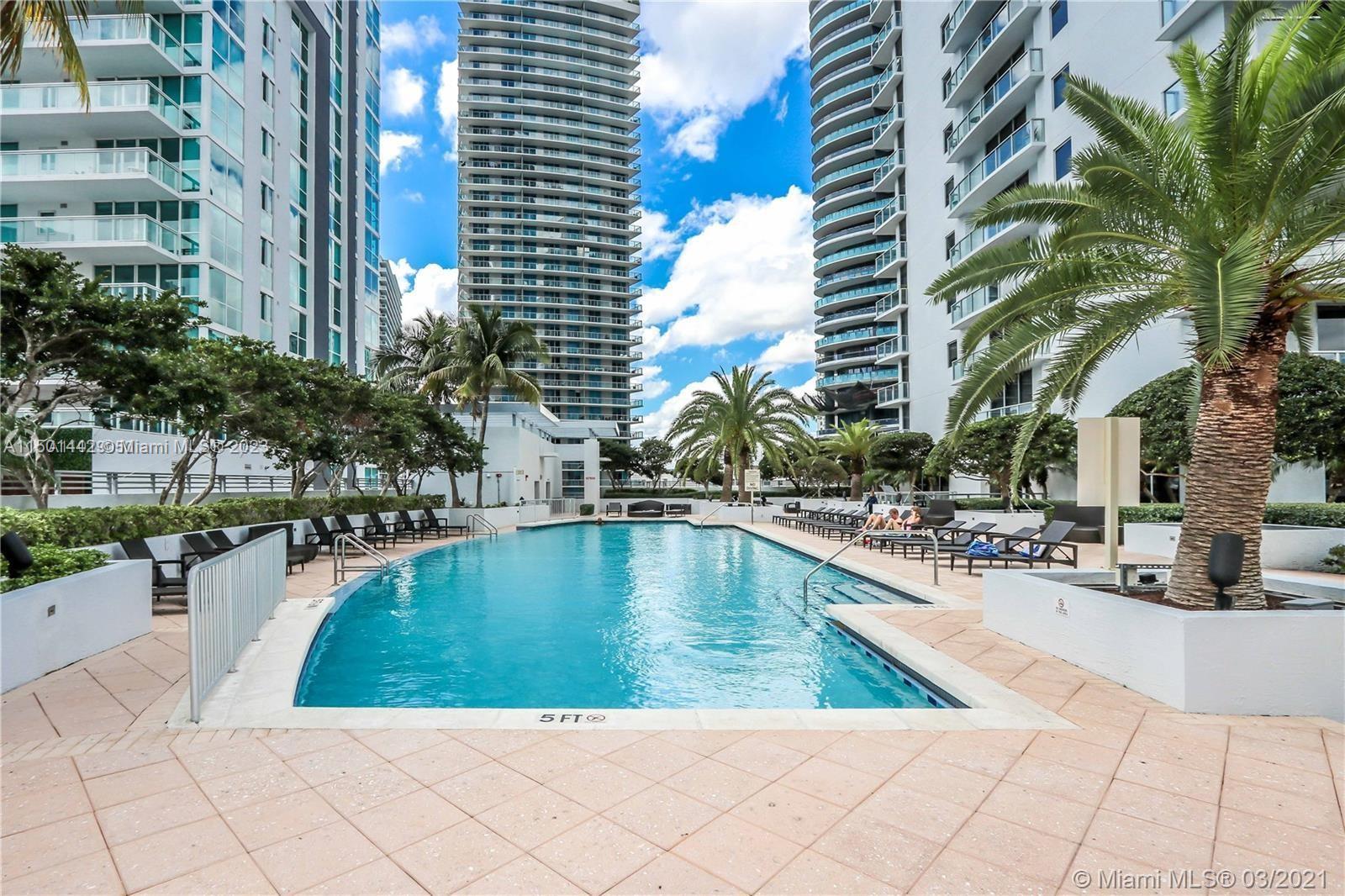 1060 Brickell Avenue, Unit 413 Miami, FL 33131 - Photo 13 of 13 a view of swimming pool with outdoor seating