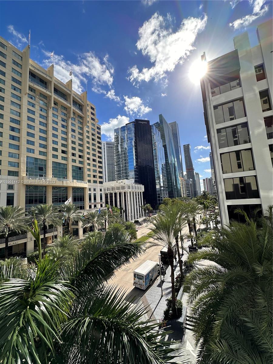 1060 Brickell Avenue, Unit 413 Miami, FL 33131 - Photo 5 of 13 a view of a house with a yard