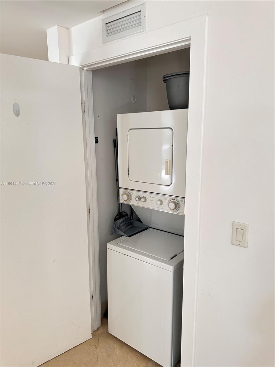 1060 Brickell Avenue, Unit 413 Miami, FL 33131 - Photo 10 of 13 a utility room with a washer and dryer