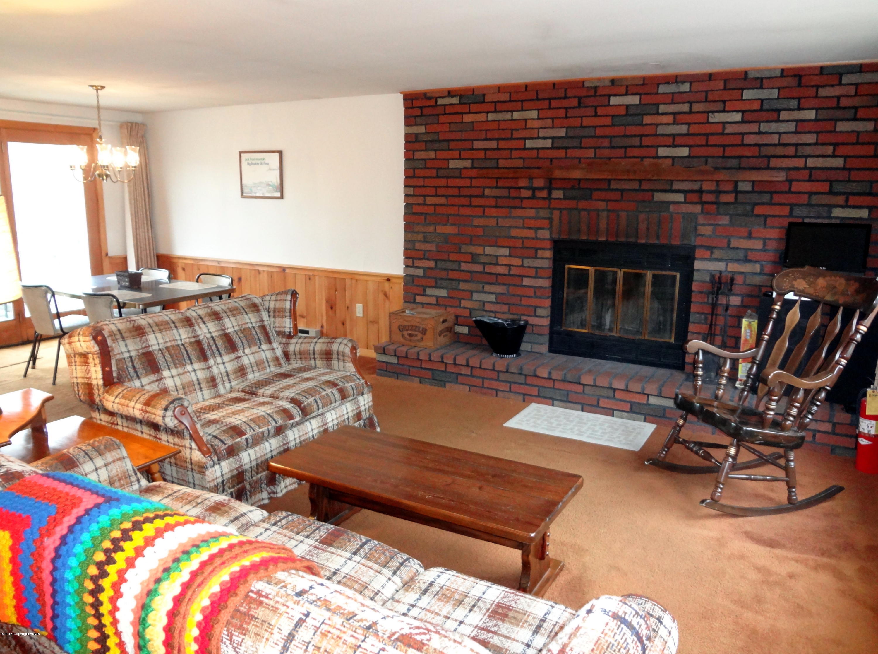 35 Shortridge Road Albrightsville, PA 18210 - Photo 12 of 27 a living room with furniture a rug and a fireplace