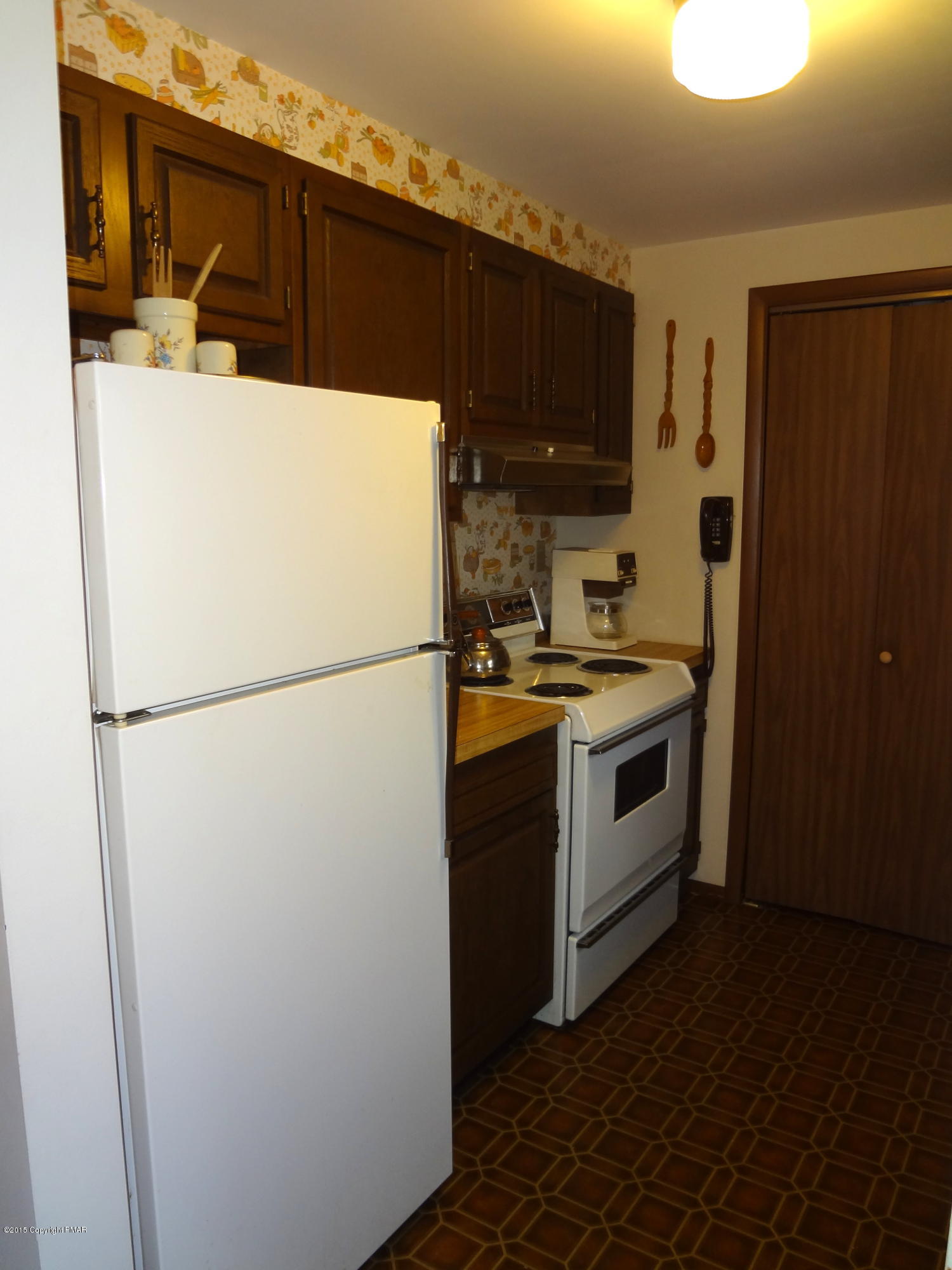 35 Shortridge Road Albrightsville, PA 18210 - Photo 18 of 27 a kitchen with a refrigerator a stove top oven and a counter space