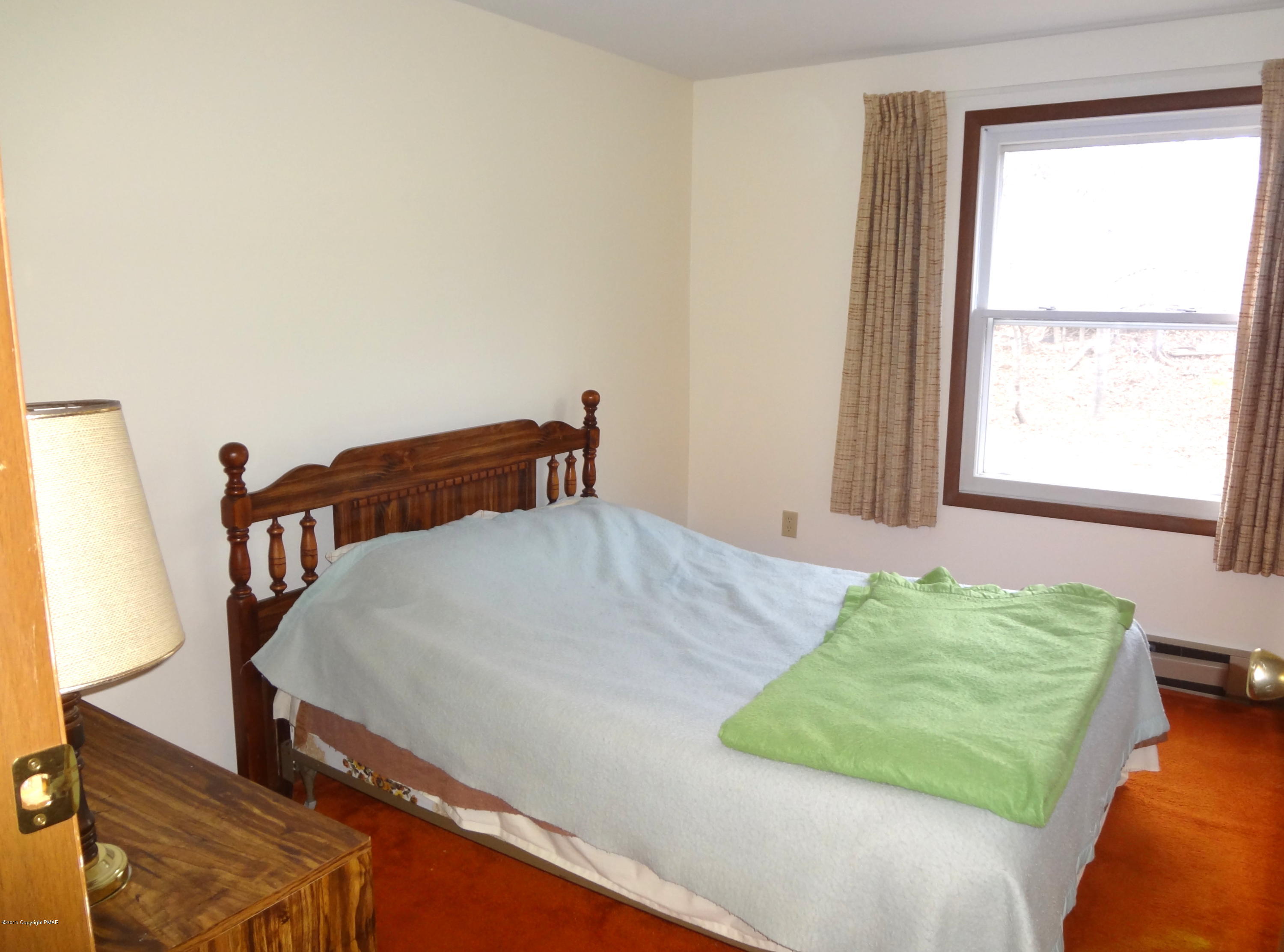 35 Shortridge Road Albrightsville, PA 18210 - Photo 24 of 27 a bedroom with a bed and a window