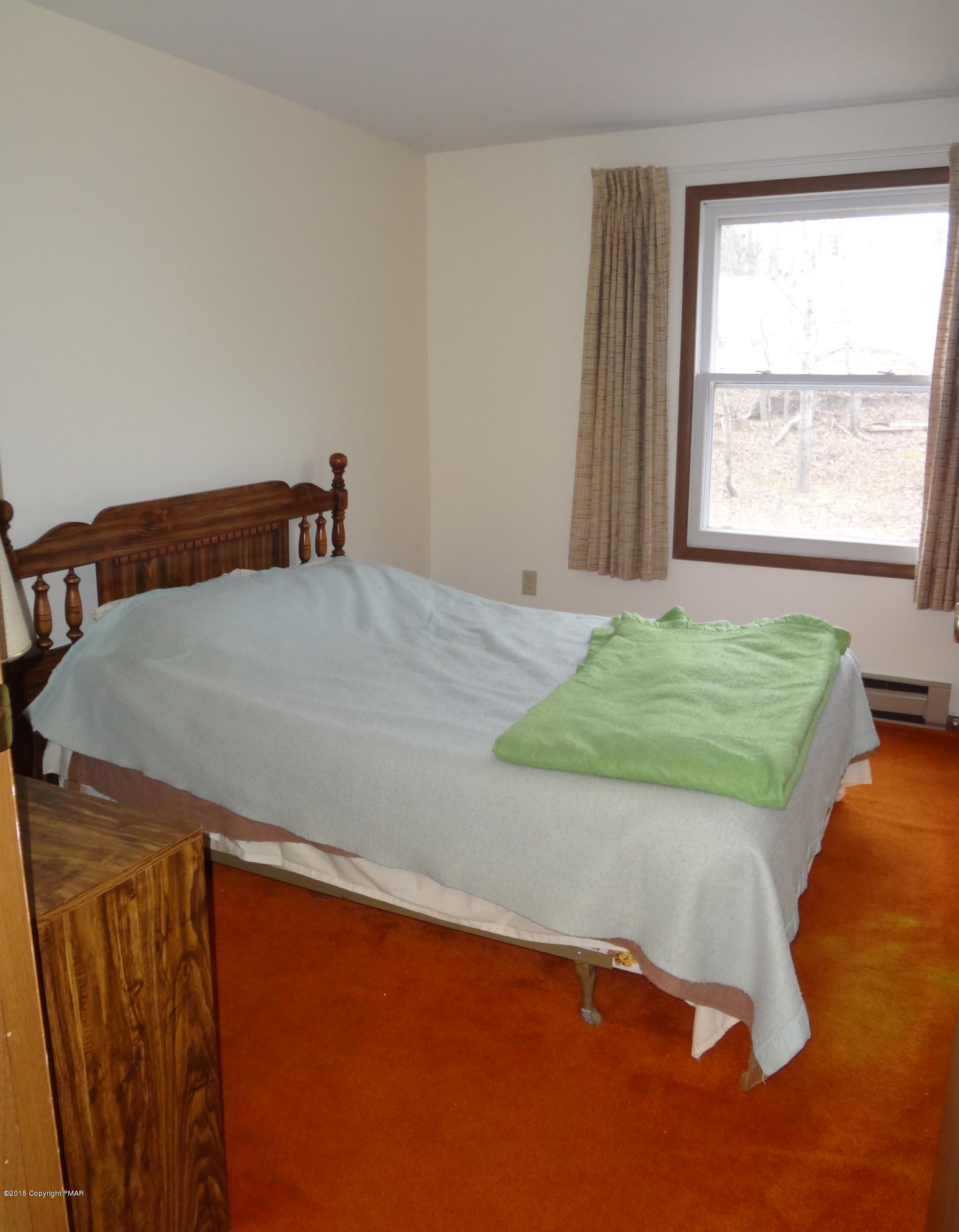 35 Shortridge Road Albrightsville, PA 18210 - Photo 25 of 27 a bed sitting in a bedroom next to a window
