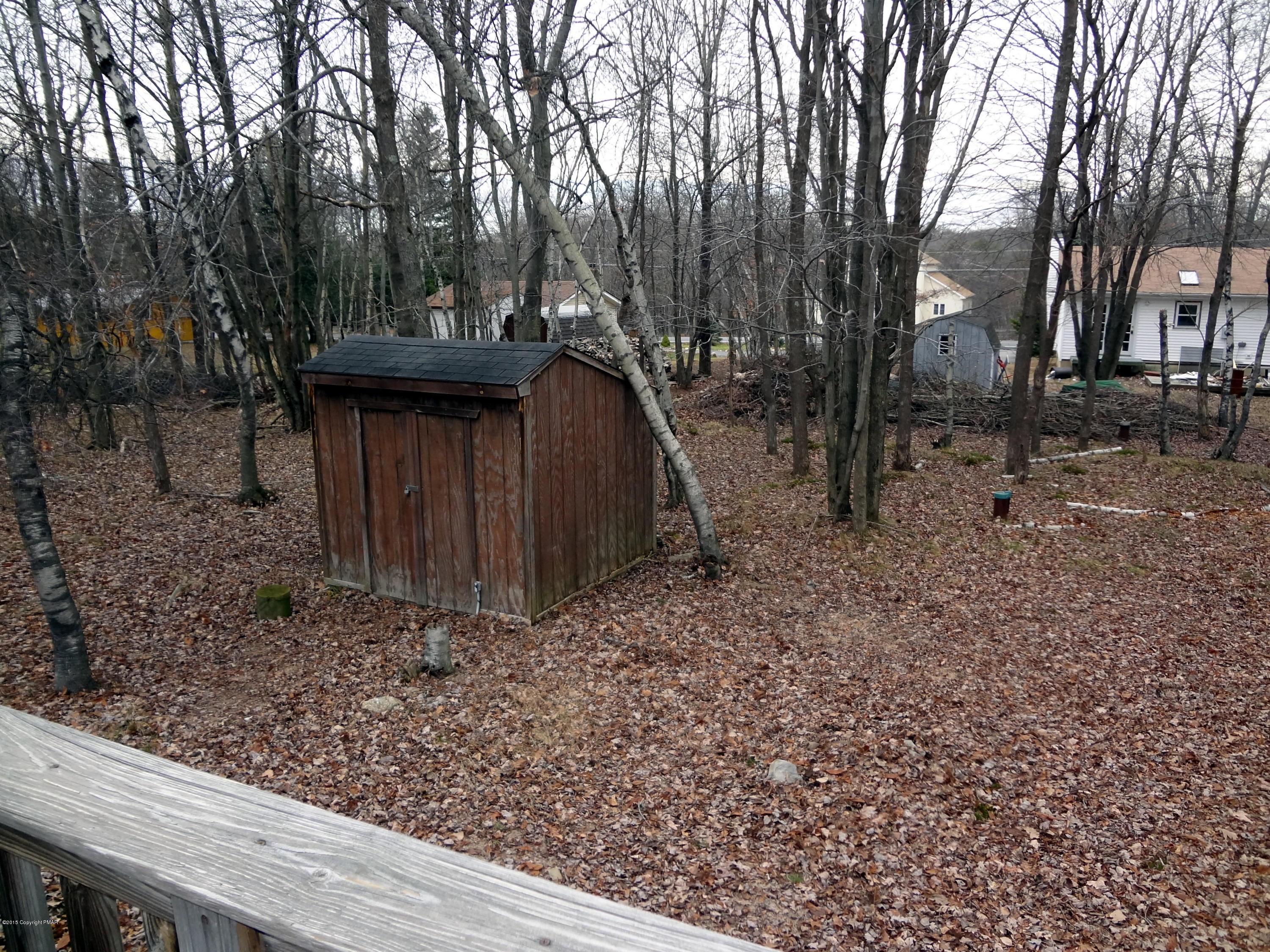 35 Shortridge Road Albrightsville, PA 18210 - Photo 3 of 27 a view of a backyard with large trees and wooden fence