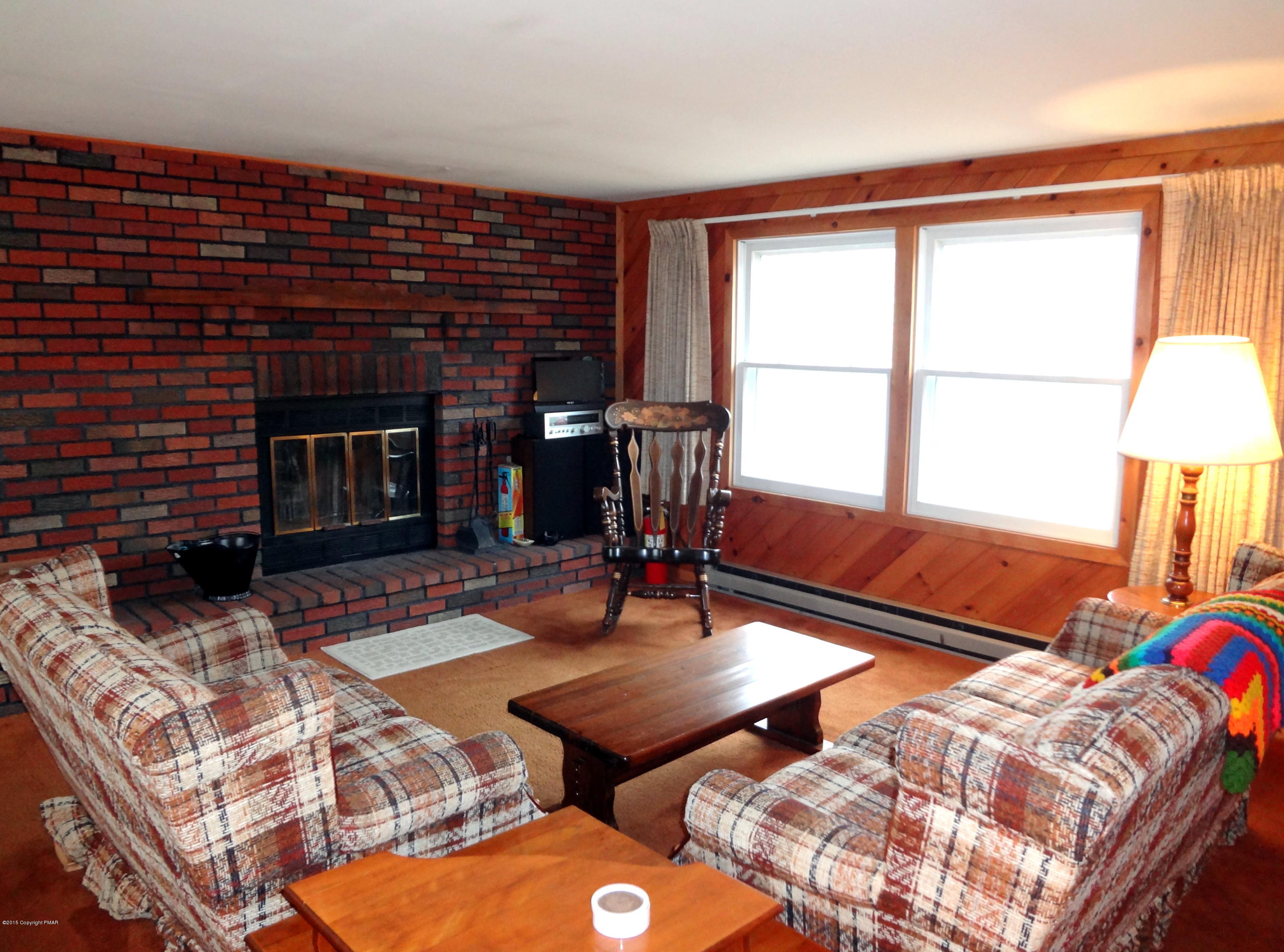 35 Shortridge Road Albrightsville, PA 18210 - Photo 7 of 27 a living room with furniture a lamp and a fireplace
