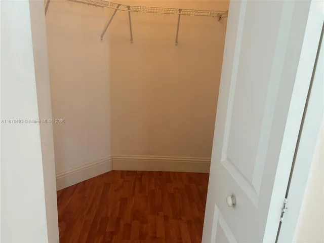 a view of gallery with wooden floor