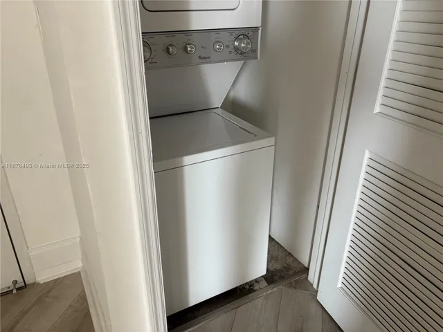 a kitchen with a sink a stove and cabinets