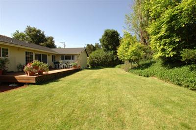 699 McClay Road Novato, CA 94947 - Photo 8 of 10 a view of a backyard with table and chairs and potted plants