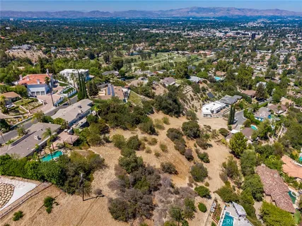 a view of a city with mountains in the background