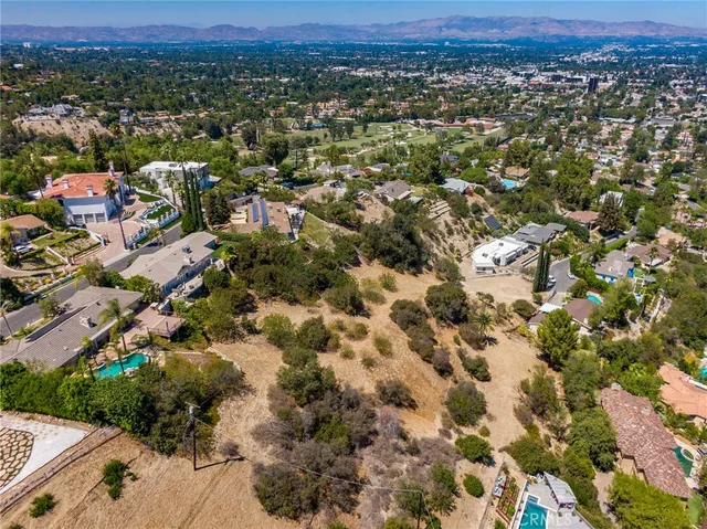 a view of a city with mountains in the background