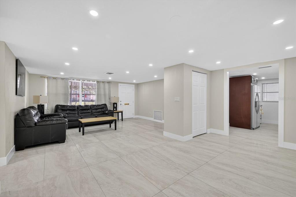 7421 Ashwood Drive Port Richey, FL 34668 - Photo 12 of 47 a living room with furniture and a counter top space