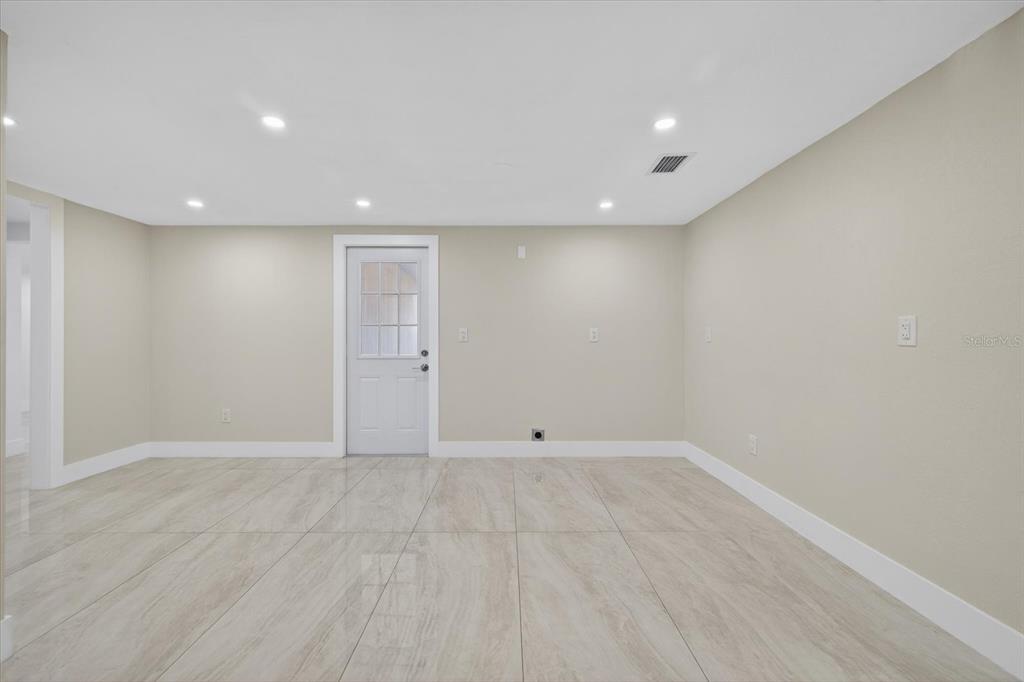 7421 Ashwood Drive Port Richey, FL 34668 - Photo 13 of 47 a view of an empty room