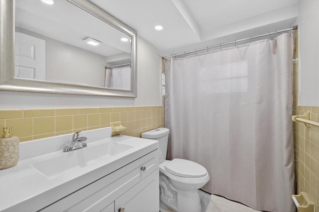 7421 Ashwood Drive Port Richey, FL 34668 - Photo 20 of 47 a bathroom with a sink a toilet and a mirror