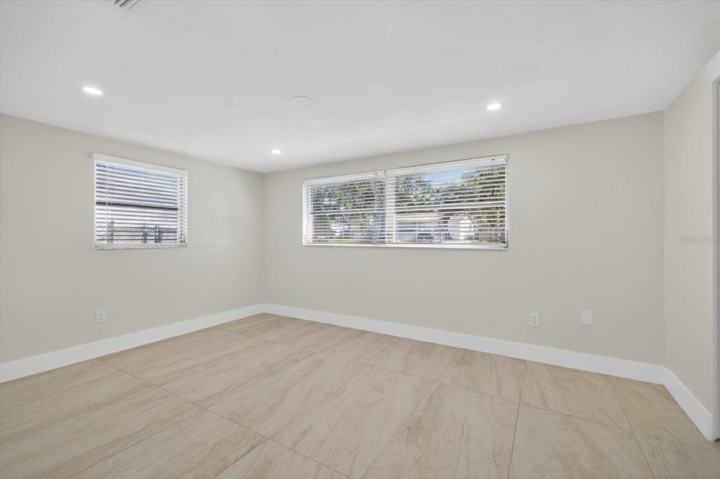 7421 Ashwood Drive Port Richey, FL 34668 - Photo 23 of 47 an empty room with windows