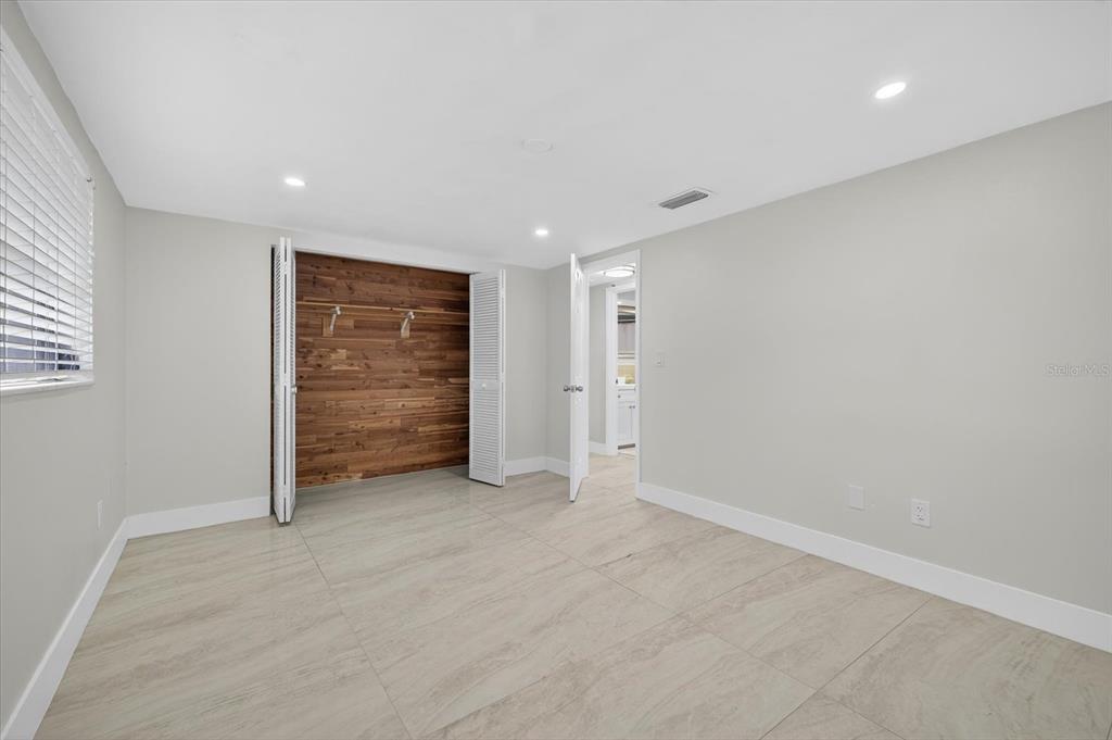 7421 Ashwood Drive Port Richey, FL 34668 - Photo 24 of 47 wooden floor in an empty room