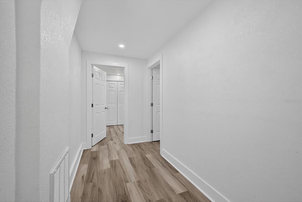 7421 Ashwood Drive Port Richey, FL 34668 - Photo 35 of 47 a view of room with wooden floor