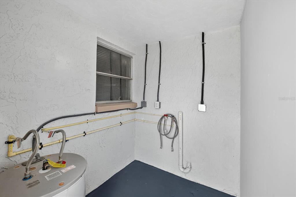 7421 Ashwood Drive Port Richey, FL 34668 - Photo 36 of 47 a bathroom with a sink and a window