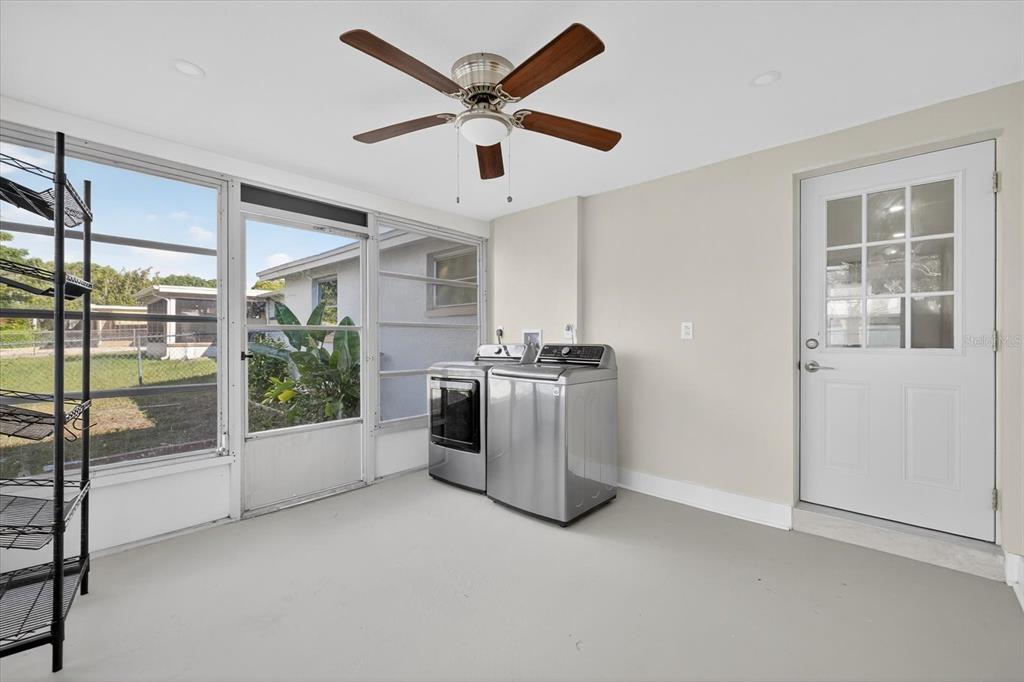 7421 Ashwood Drive Port Richey, FL 34668 - Photo 37 of 47 a view of a livingroom with a ceiling fan and window