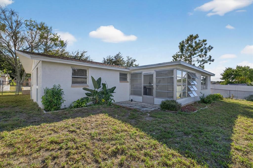 7421 Ashwood Drive Port Richey, FL 34668 - Photo 39 of 47 a view of a house with a yard