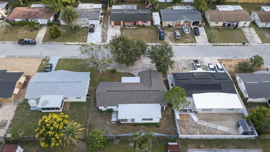 7421 Ashwood Drive Port Richey, FL 34668 - Photo 43 of 47 an aerial view of multiple houses with a yard