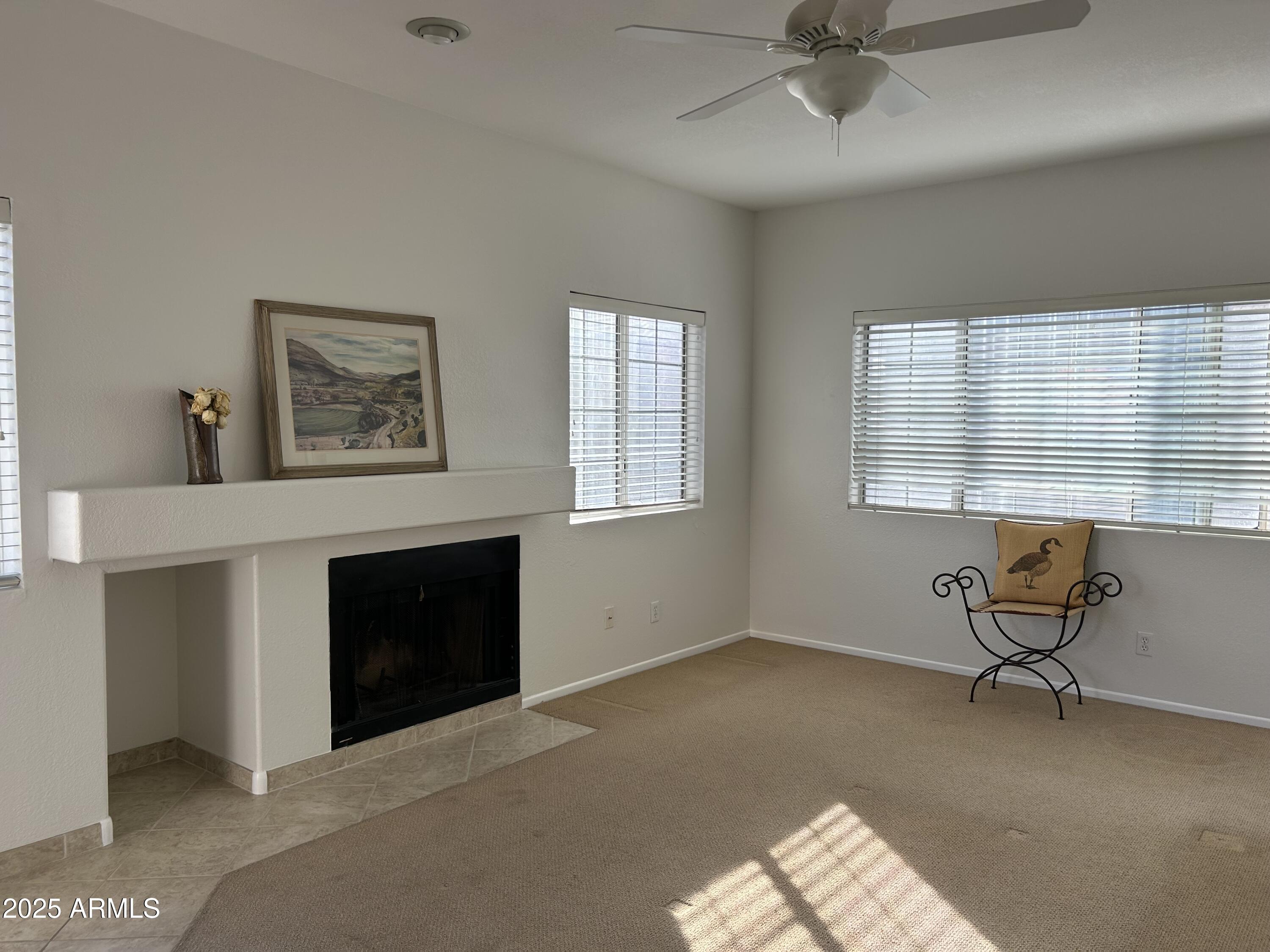 7710 East Gainey Ranch Road, Unit 212 Scottsdale, AZ 85258 - Photo 5 of 33 LIVING AREA W FIREPLACE
