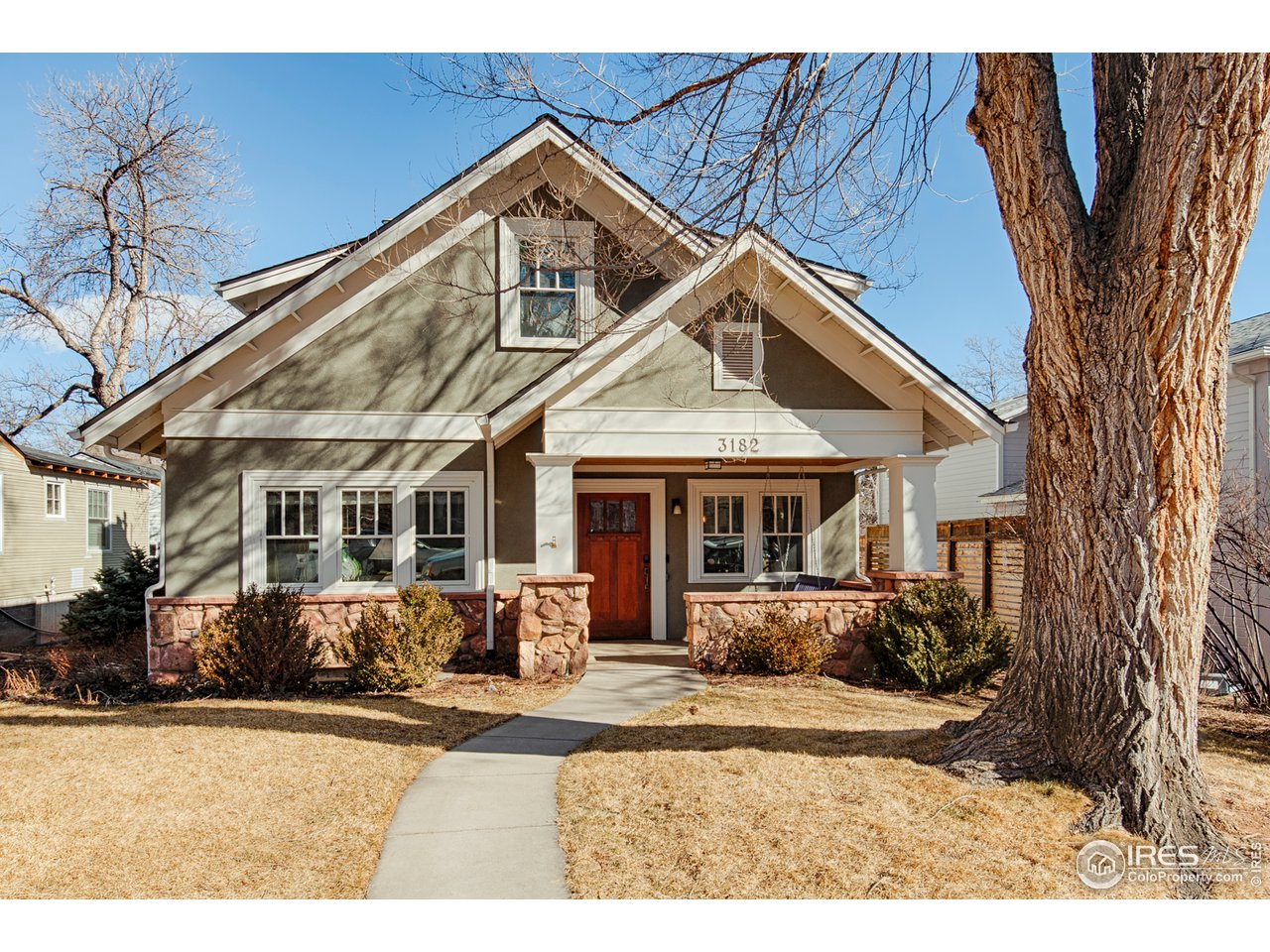 3182 7th Street Boulder, CO 80304 - Photo 1 of 38 a front view of a house with yard porch and glass windows