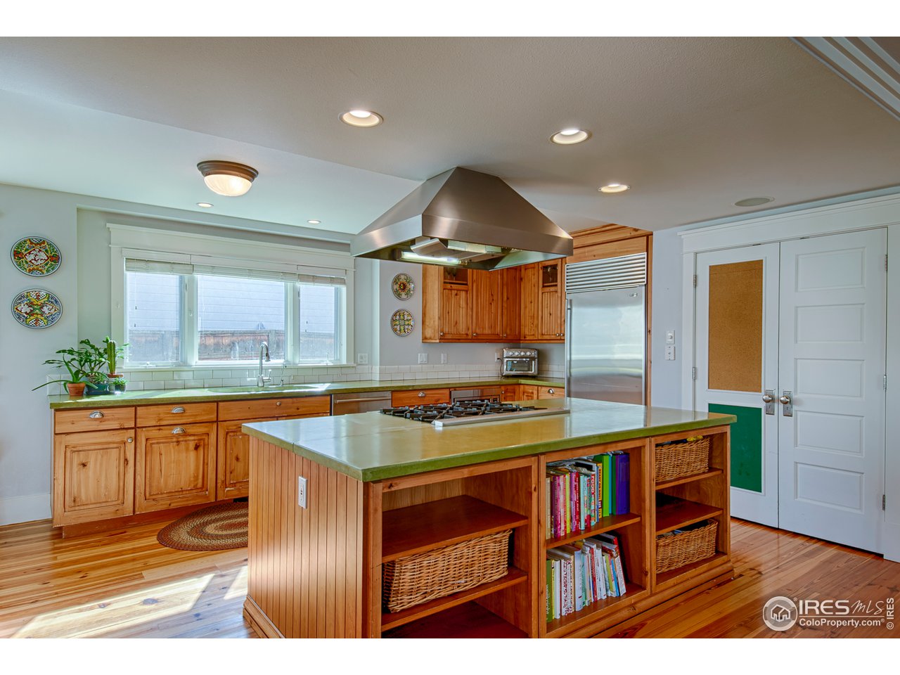 3182 7th Street Boulder, CO 80304 - Photo 14 of 38 a kitchen with stainless steel appliances granite countertop a stove a sink and a refrigerator