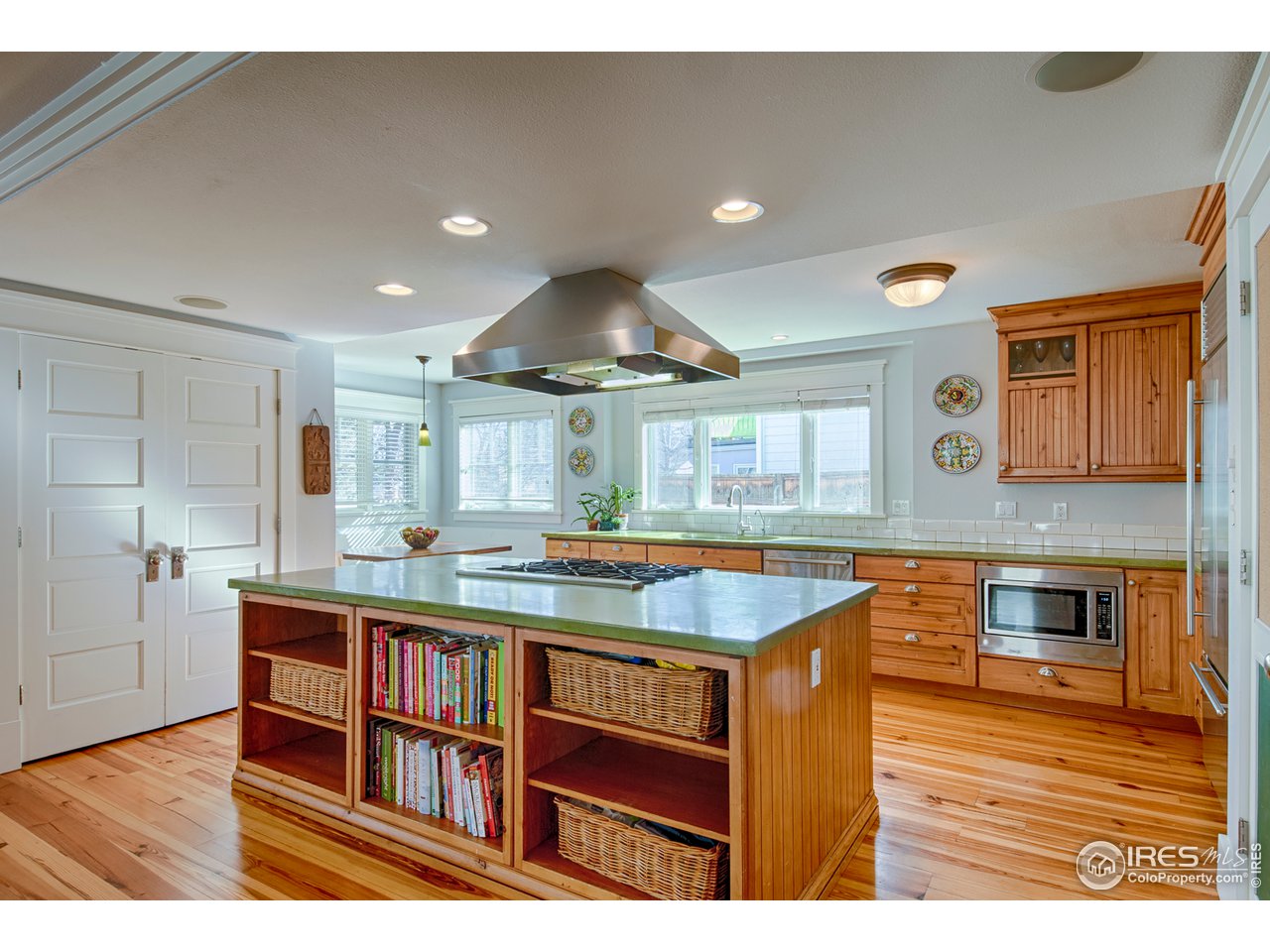 3182 7th Street Boulder, CO 80304 - Photo 16 of 38 a kitchen with stainless steel appliances granite countertop a sink stove and refrigerator