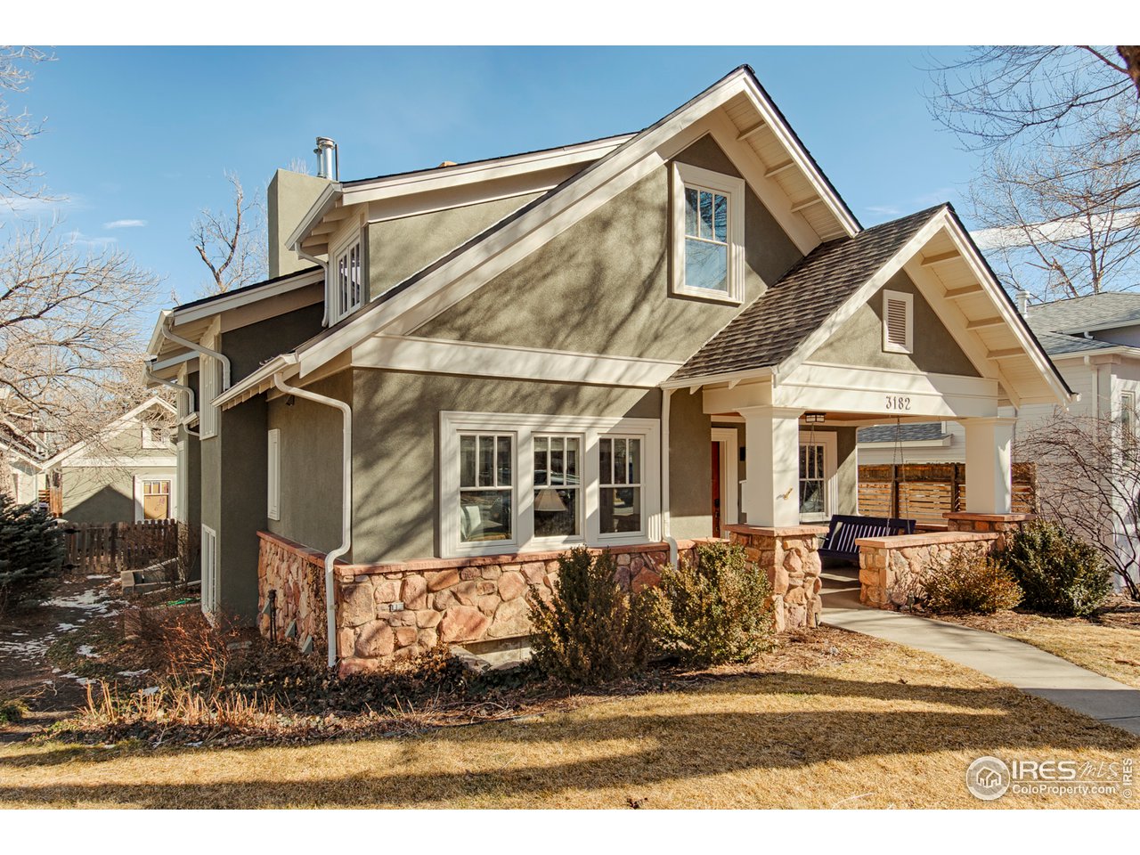 3182 7th Street Boulder, CO 80304 - Photo 2 of 38 a front view of a house with a yard
