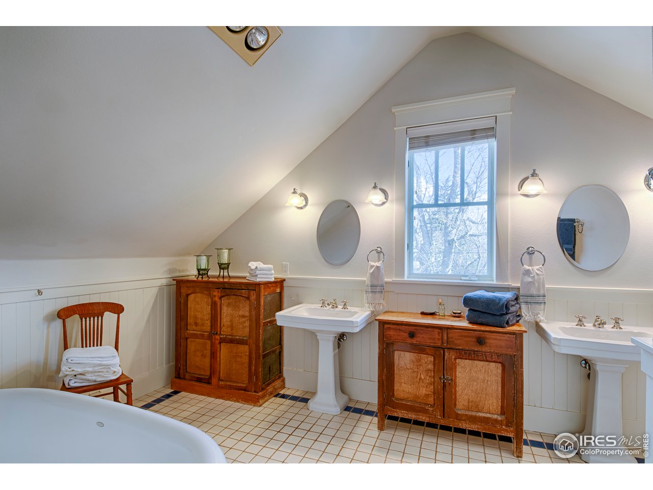 3182 7th Street Boulder, CO 80304 - Photo 21 of 38 a bedroom with a bed and wooden floor