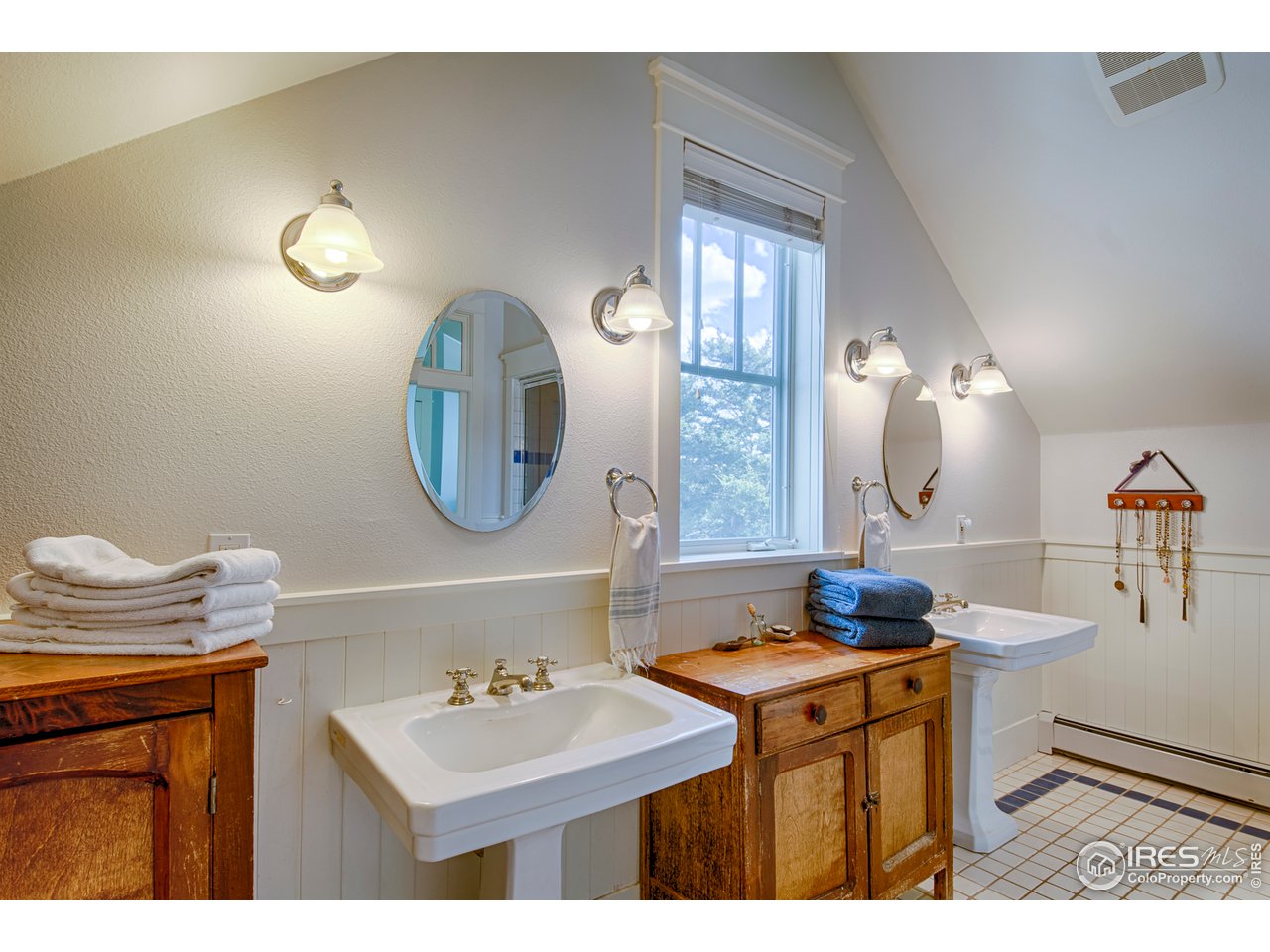 3182 7th Street Boulder, CO 80304 - Photo 23 of 38 a bathroom with a sink and a mirror