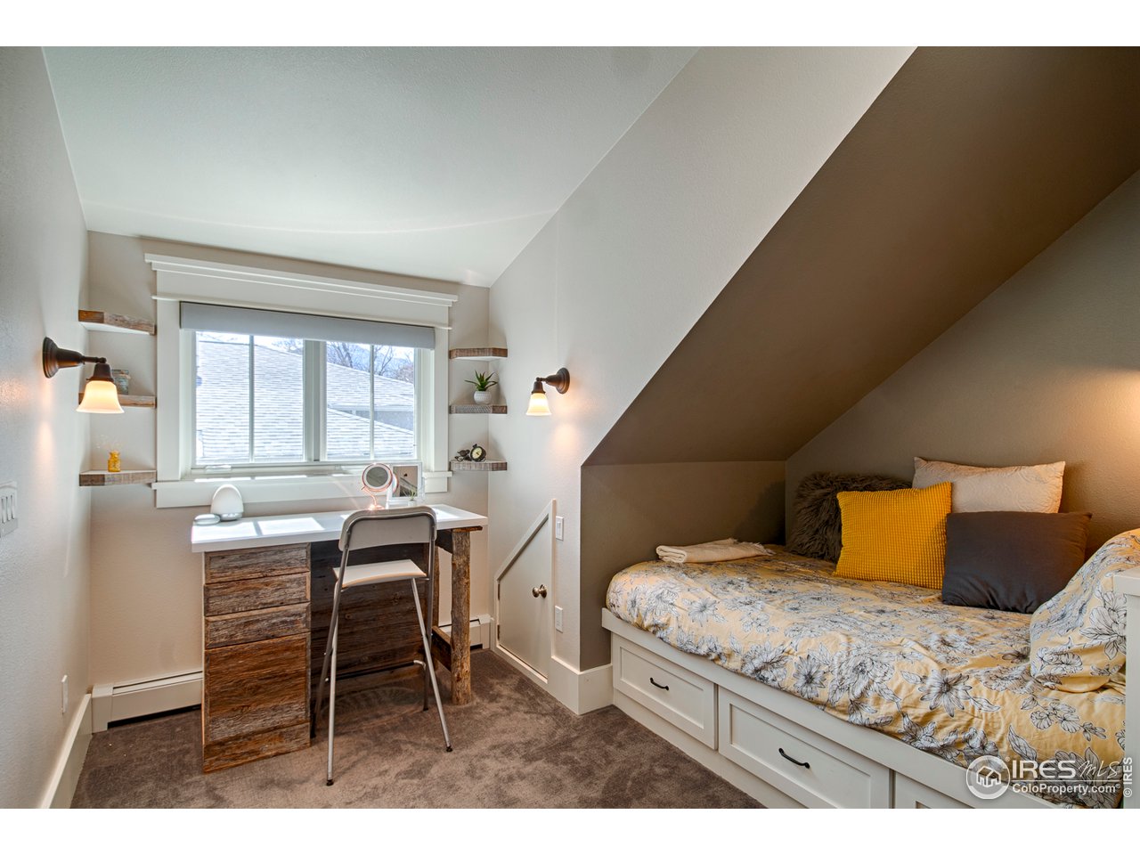 3182 7th Street Boulder, CO 80304 - Photo 25 of 38 a bedroom with a bed and a table in it