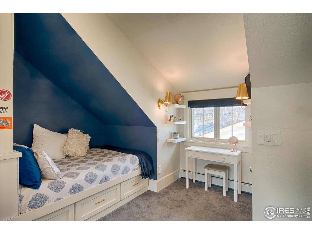 3182 7th Street Boulder, CO 80304 - Photo 27 of 38 a bedroom with a bed and a window