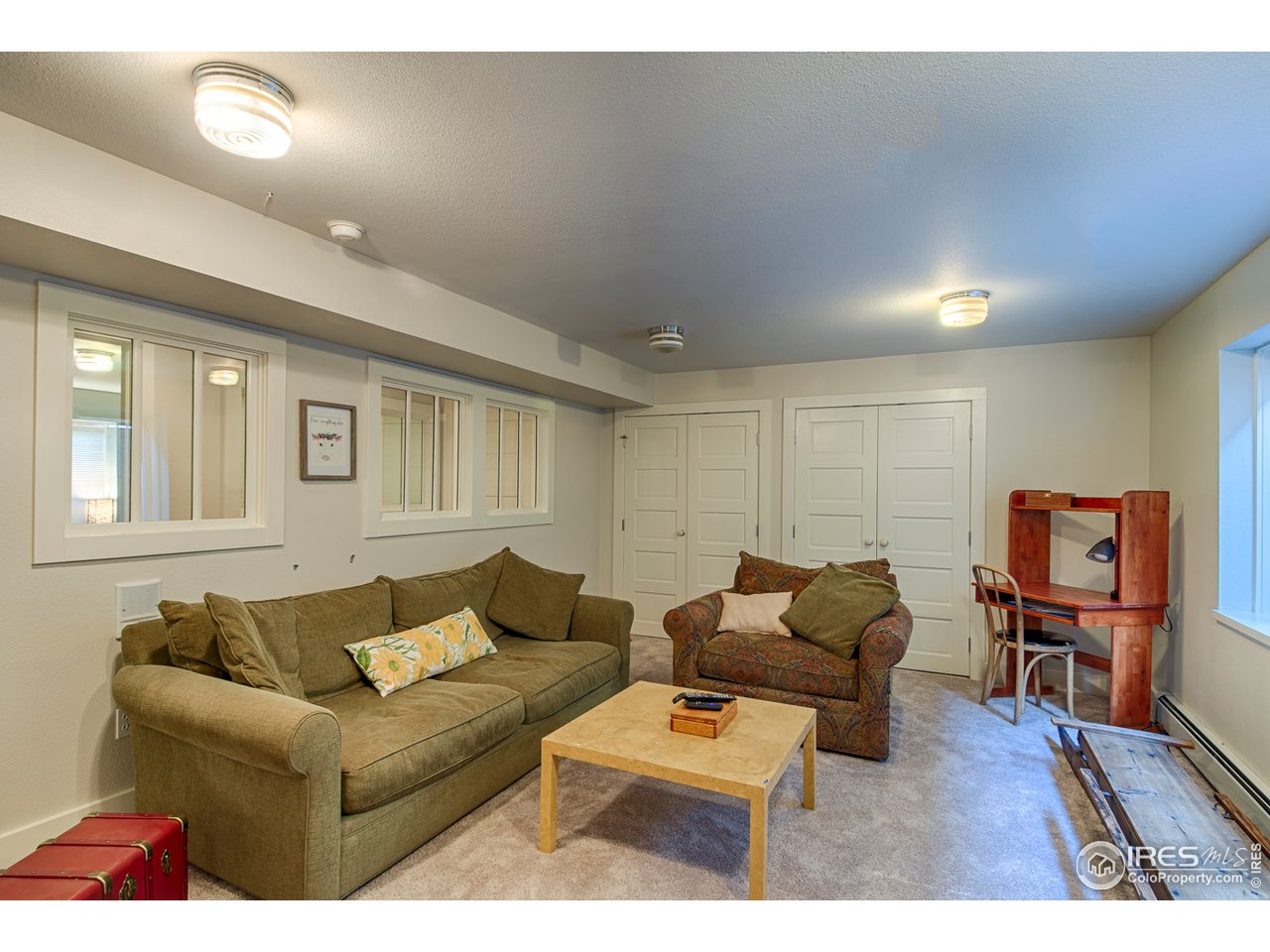 3182 7th Street Boulder, CO 80304 - Photo 31 of 38 a living room with furniture and a flat screen tv with wooden floor