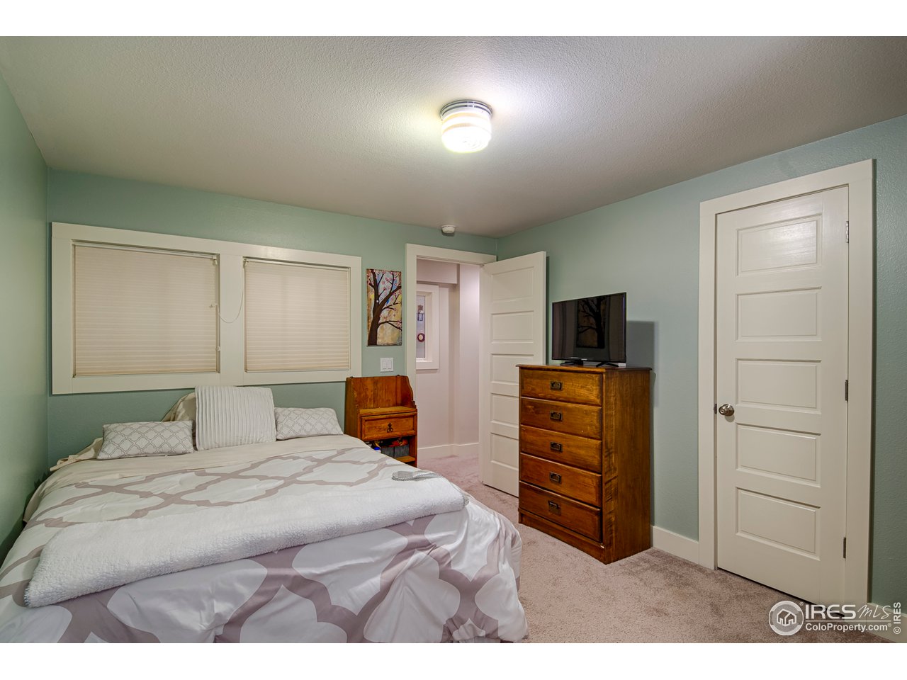 3182 7th Street Boulder, CO 80304 - Photo 32 of 38 a bedroom with a bed and furniture