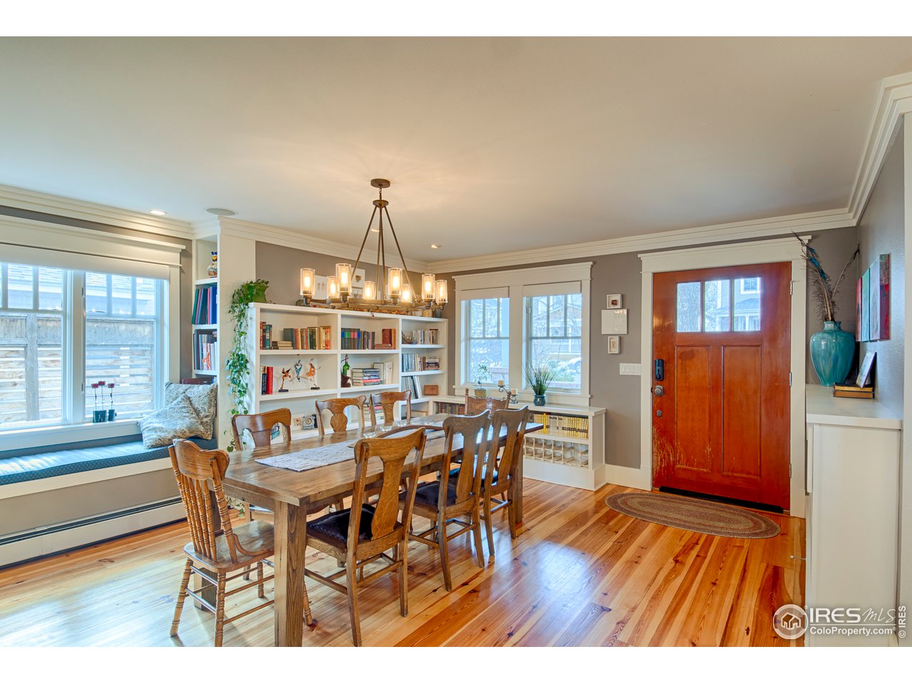 3182 7th Street Boulder, CO 80304 - Photo 4 of 38 a view of a dining room with furniture wooden floor and chandelier