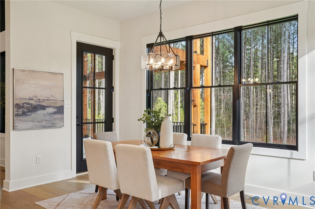 1165 Cardinal Crest Terrace Midlothian, VA 23113 - Photo 11 of 50 a view of a dining room with furniture window and wooden floor