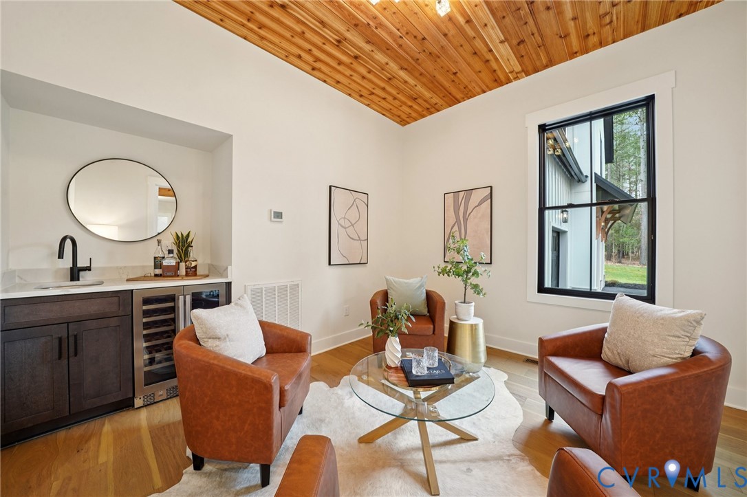 1165 Cardinal Crest Terrace Midlothian, VA 23113 - Photo 15 of 50 a living room with furniture a wooden floor and a large window