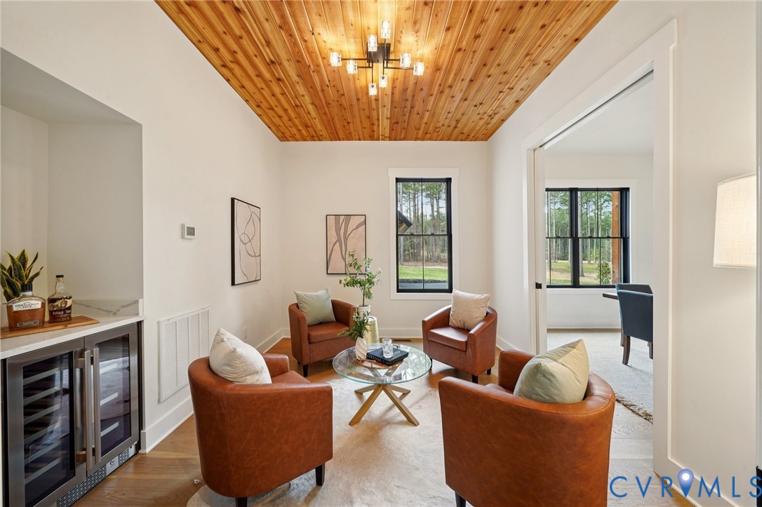 1165 Cardinal Crest Terrace Midlothian, VA 23113 - Photo 16 of 50 a living room with furniture a chandelier and a window