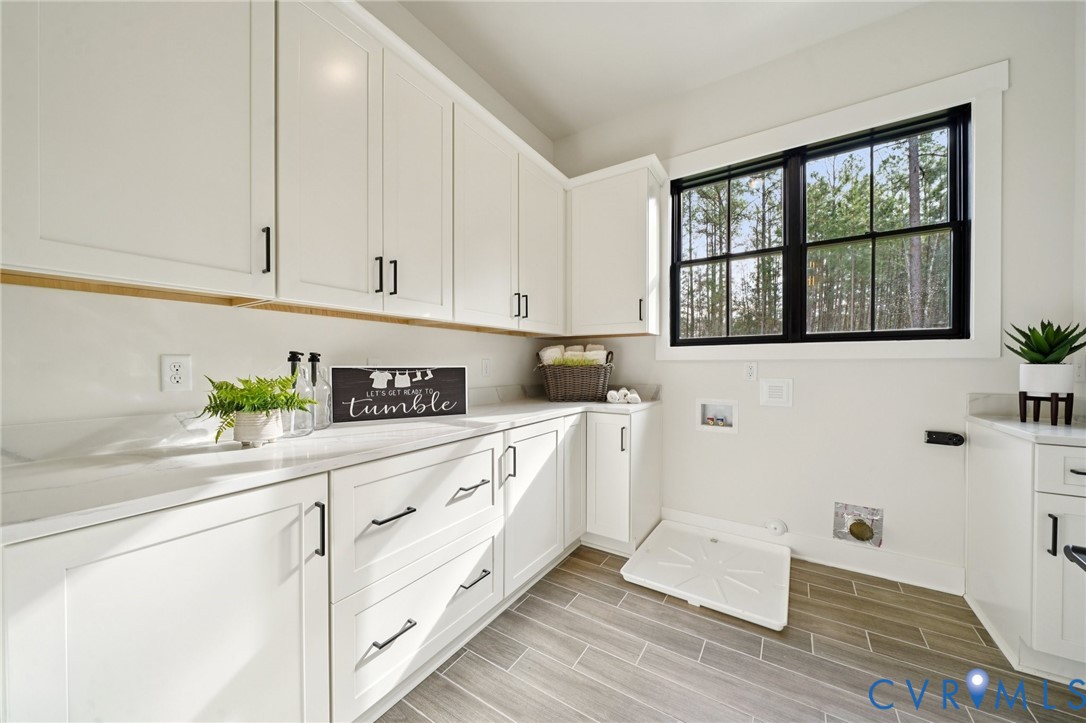 1165 Cardinal Crest Terrace Midlothian, VA 23113 - Photo 24 of 50 a kitchen with stainless steel appliances white cabinets and a window