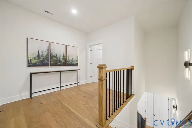 a view of a hallway with staircase