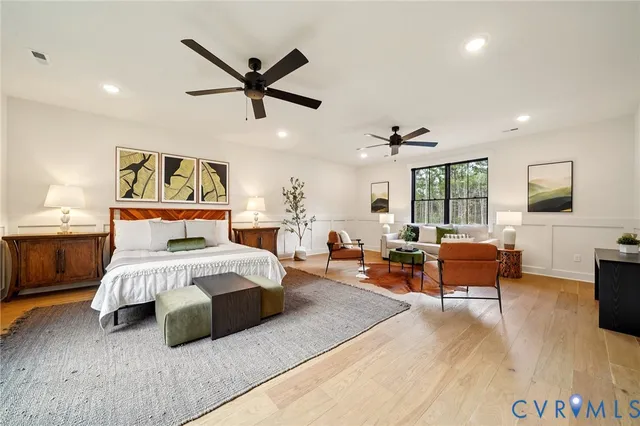 a bedroom with a large bed and a couch