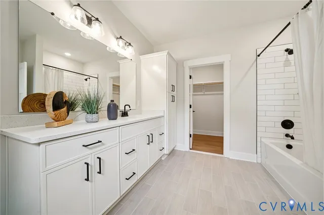an empty room with window and wooden floor