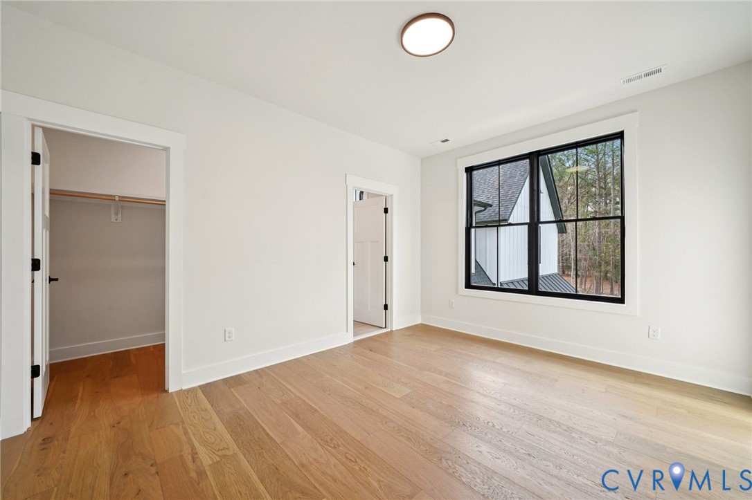 1165 Cardinal Crest Terrace Midlothian, VA 23113 - Photo 35 of 50 an empty room with window and wooden floor