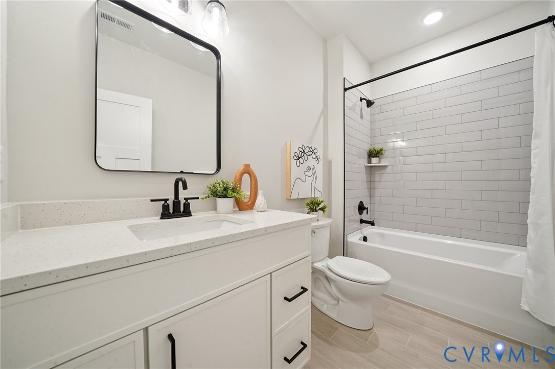 1165 Cardinal Crest Terrace Midlothian, VA 23113 - Photo 36 of 50 a bathroom with a sink a toilet and shower