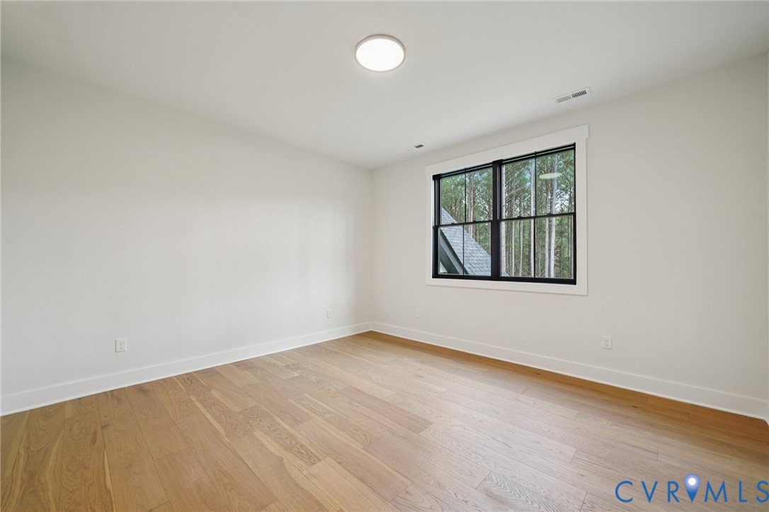 1165 Cardinal Crest Terrace Midlothian, VA 23113 - Photo 38 of 50 an empty room with wooden floor and windows