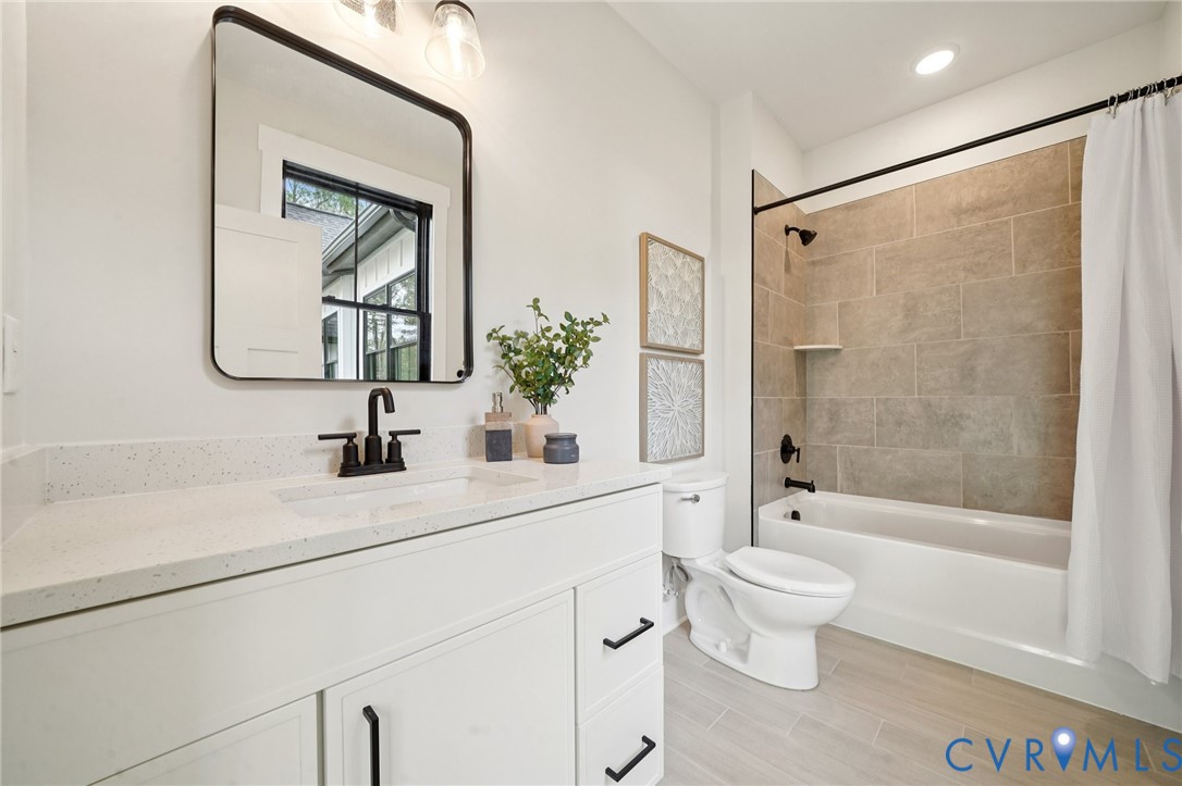 1165 Cardinal Crest Terrace Midlothian, VA 23113 - Photo 39 of 50 a bathroom with a bathtub shower sink vanity and toilet