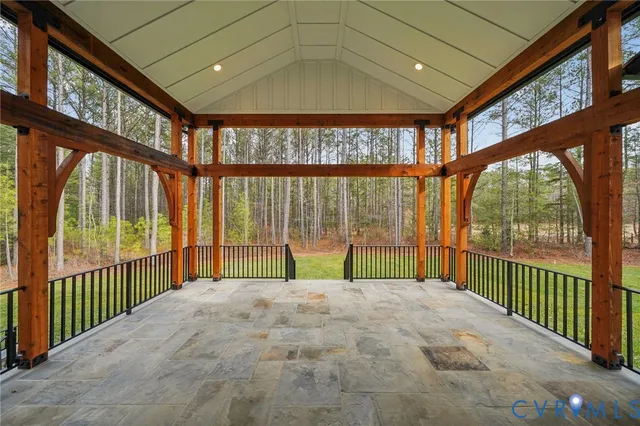 a swimming pool with outdoor seating and garden