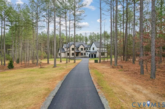 an aerial view of a house with outdoor space